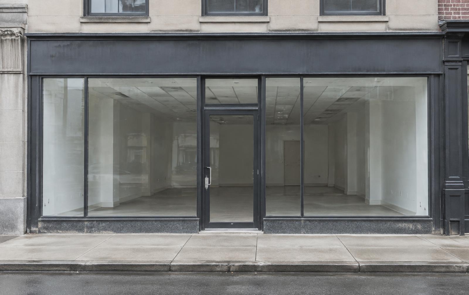 Empty storefront with bare glass windows